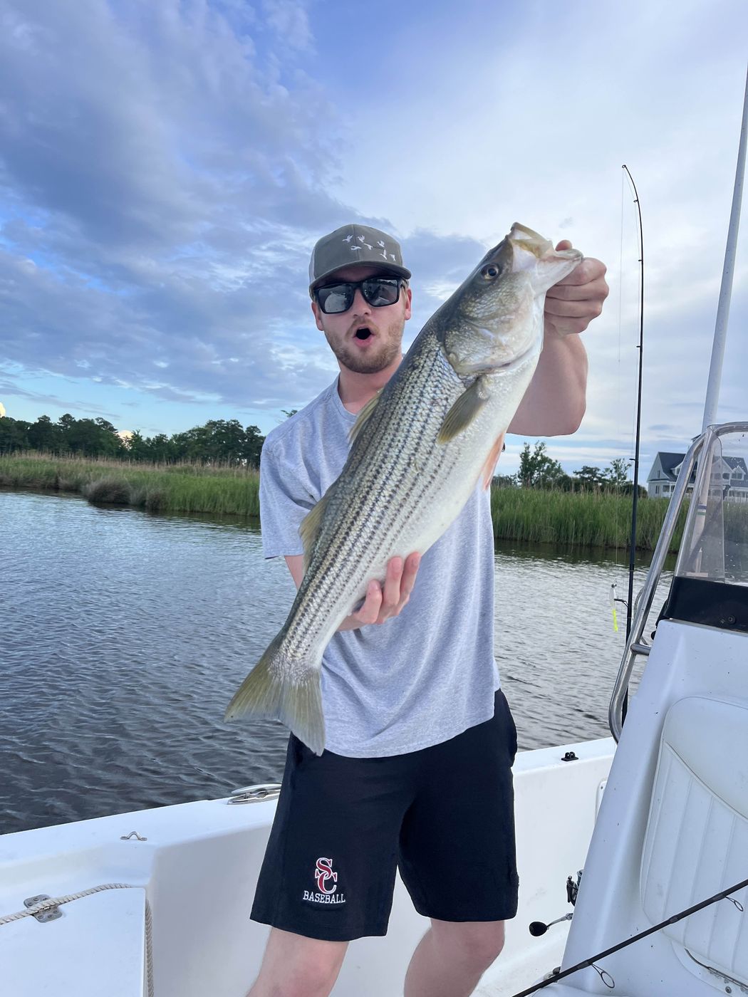 Angler with a striped bass