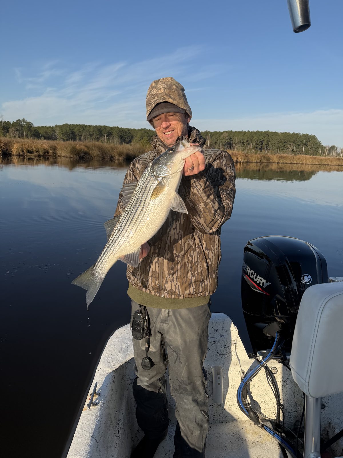 Angler with a striped bass from Eastern North Carolina